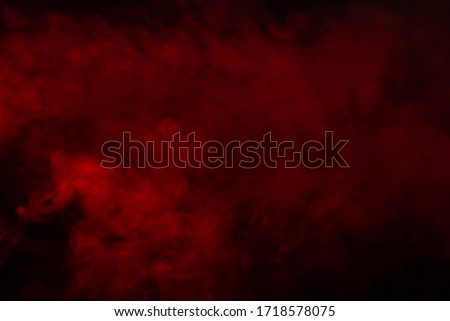 Red steam on a black background. Copy space. Royalty-Free Stock Photo #1718578075