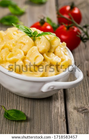 Mac and Cheese on Wooden Background. Selective focus.