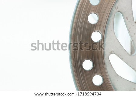 Close up motorcycle disc break part on isolated white background with copy space.