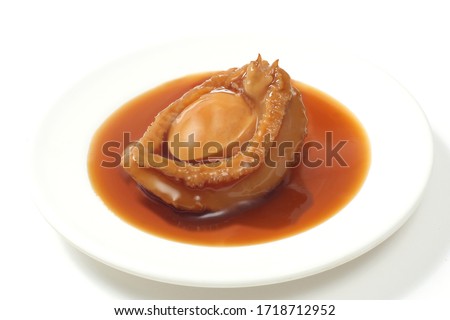 Abalone dish dipped in sauce Royalty-Free Stock Photo #1718712952