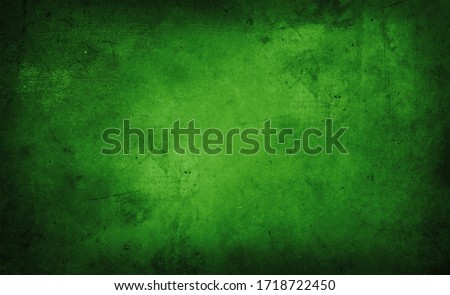 Closeup of green textured wall, dark edges
