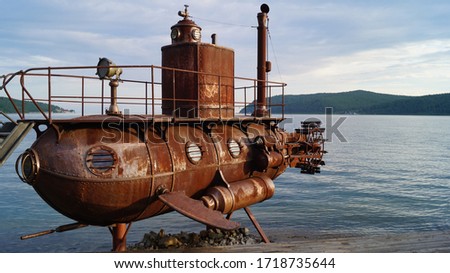 Old submarine near lake Baikal in Russia.  Lake Baikal  is a rift lake located in southern Siberia, Russia. Royalty-Free Stock Photo #1718735644
