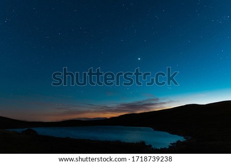Starry night sky in the mountains.