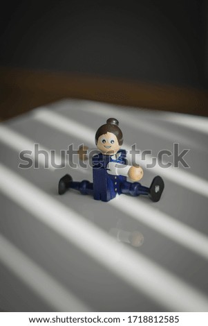 wooden toy figure, happy man stretching, doing yoga