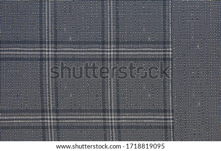 Checkered blue background. The texture of the fabric in the cell. Combined fabric.