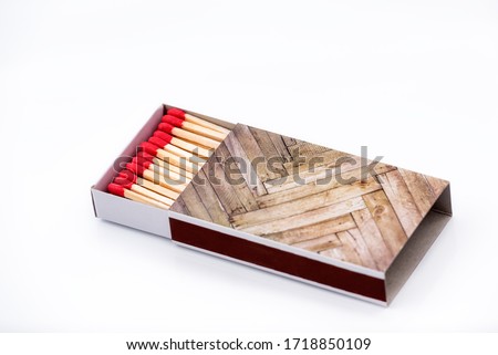 Matches on a white background close-up. Box of matches. Matches made of wood and sulfur. The ignition of matches.
