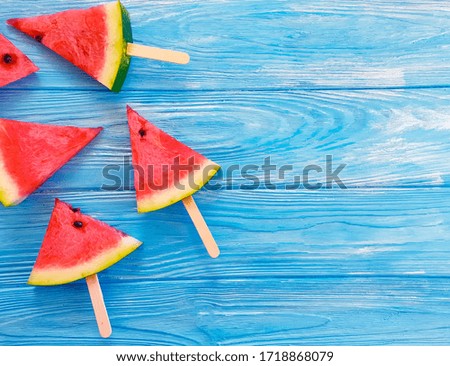 fresh slices of watermelon on a wooden background