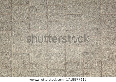 Toned photo of stone paving slabs. Dirty gray background for sites and layouts.