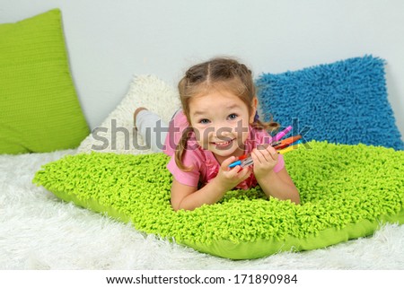 Little girl lying in bed 