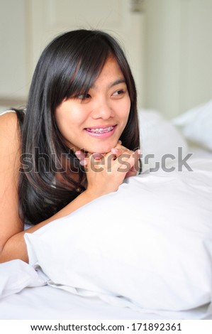 Woman relaxing looking happy and smiling