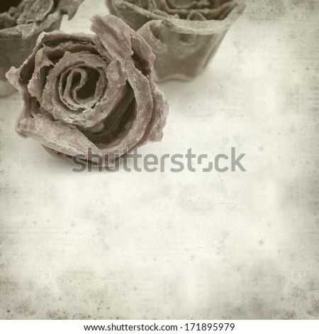 textured old paper background with rose kindling