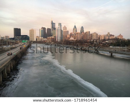 Philadelphia cityscape with frozen river during winter