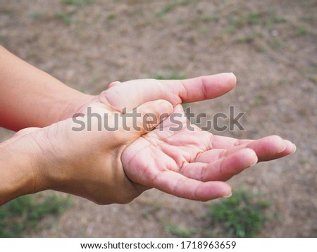 Close up of hand massage on palms to relift ache, hand pain and numb.