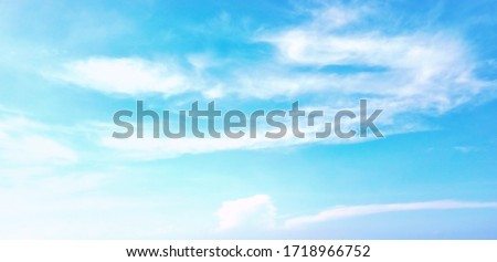 Beautiful blue sky and white clouds of various shapes with sunlight. Nature background Royalty-Free Stock Photo #1718966752
