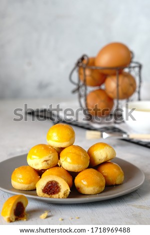 Nastar Cookies, Pineapple tarts or nanas tart are small, bite-size pastries filled or topped with pineapple jam, commonly found throughout different parts of Southeast Asia such as Indonesia (nastar), Royalty-Free Stock Photo #1718969488