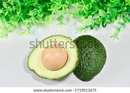 Half cut avocado Placed on a white background
