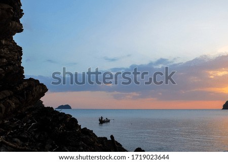 Sun setting over an island in Langkawi, Malaysia