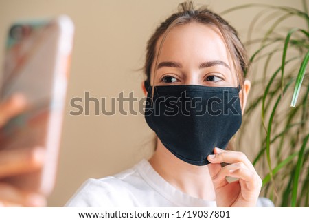 COVID-19 Pandemic Coronavirus A young woman wearing black face mask, Dust protection against virus. Coronavirus Royalty-Free Stock Photo #1719037801