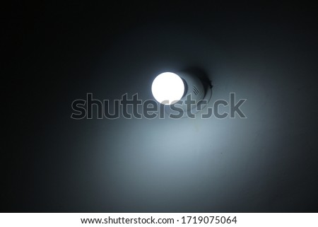 Glowing led night bulb on wall