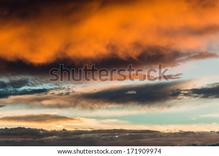 Sunset Colours Sky Clouds  Sunset skies with cloud colours and  dark grey rain clouds 