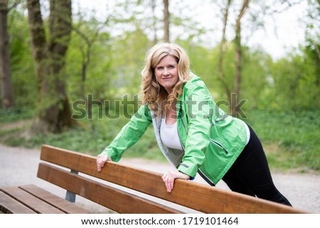 
Middle-aged woman active outdoors in nature