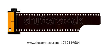 Camera film roll cartridge or 35mm filmstrip.equipment for photograph on white background. Royalty-Free Stock Photo #1719119584