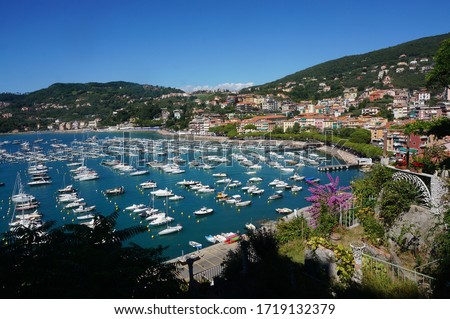 High Angel View Of Sailboat Port and townscape, surrounded with mountains, clear and blue sky background such a beautiful view of Lerici, Liguria, Italy