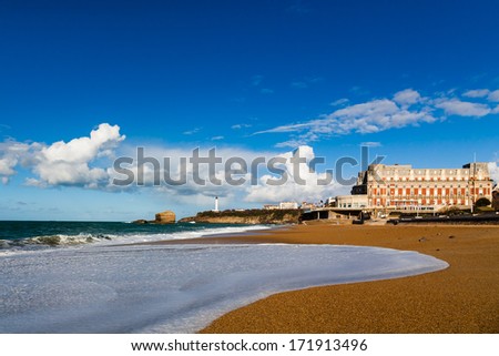 The Grande Plage form Biarritz under a partially cloudy blue sky. Famous Hotel du Palais in the background Royalty-Free Stock Photo #171913496