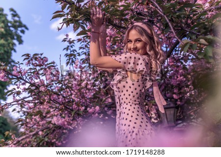 Beautiful woman in pink magnolia