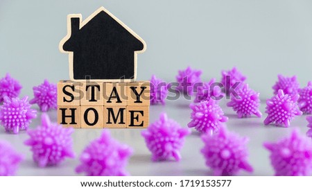Social media awareness campaign and coronavirus prevention concept with word "STAY HOME" on gray background.