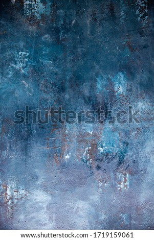 Dark, blue, textured surface shot overhead Royalty-Free Stock Photo #1719159061