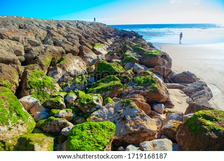 beach of Atlantic Ocean with big rocks