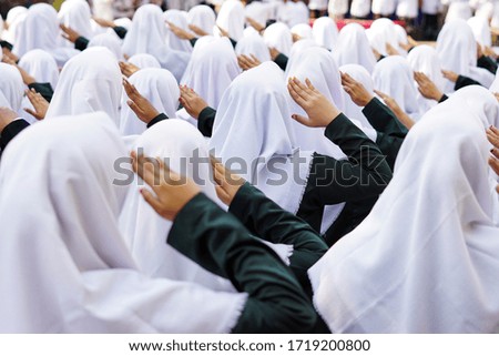 The Woman Students Of Islamic School Wearing White Hijab Veil Lined Up And Salute During The Commemoration Of Indonesian Independence Day