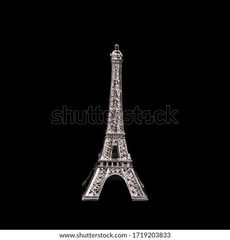 Eiffel tower decoration on a black background. 