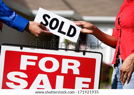 Real Estate: Agent Giving Buyer Sold Sign