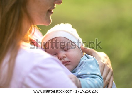 Newborn baby sleeps on mom’s chest. Happiness and intimacy of parental affection