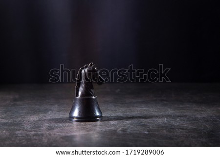 Black horse Chess on black background.