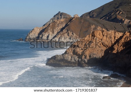Blue Ocean meeting rocky shore line