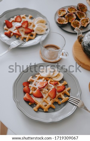 Viennese waffles with strawberries and bananas. Beautiful breakfast