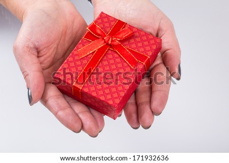 gift on palm in order to give (female hand)