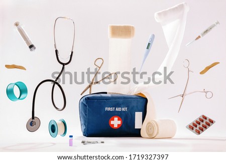First aid kit content isolated on white background. Royalty-Free Stock Photo #1719327397