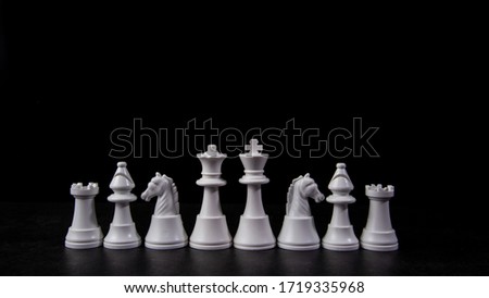 Set of White Chess on black background.