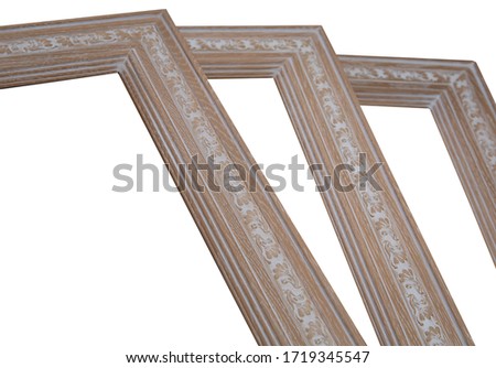 closeup stack of wooden empty vintage frame isolated on white ba