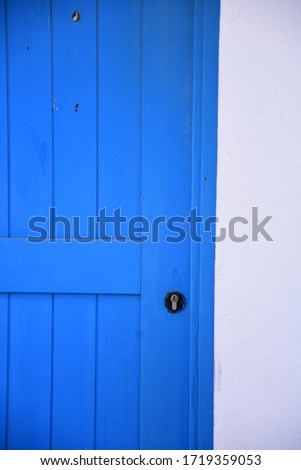blue door on white wall 