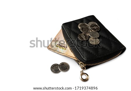 Thai money in blackwallets on white background.
Banknote and coins. Royalty-Free Stock Photo #1719374896