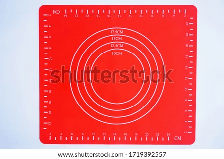 red baking scale board on white background