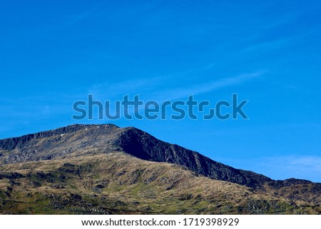 A Welsh mountain contrasted against a beautiful blue sky.