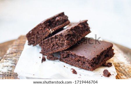 Chocolate brownies on parchment paper. Homemade bakery and vegan sweet dessert . Royalty-Free Stock Photo #1719446704