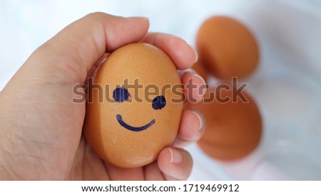brown eggs with happy face and friends