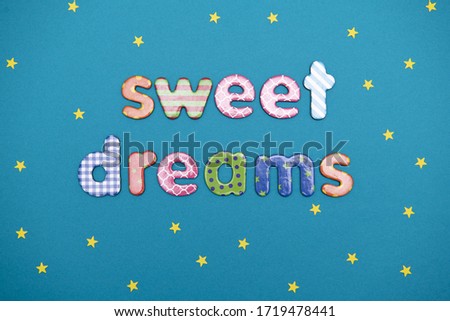 message sweet dreams on a blue background with yellow stars